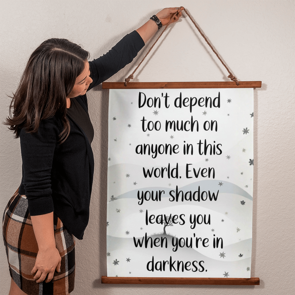 Close up of printed design on polyester fabric wood framed tapestry inspirational quote