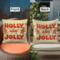 Festive Holly and Jolly throw pillow on a cozy holiday sofa scene