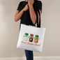 Green Christmas tote with jars of sugar and cocoa