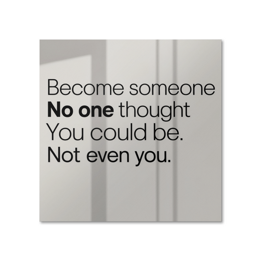 Motivational poster with quote “Become Someone No One Thought You Could Be” displayed on white wal