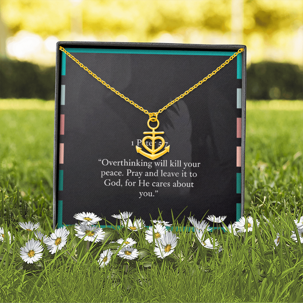 Close-up of engraved anchor charm reflecting soft light