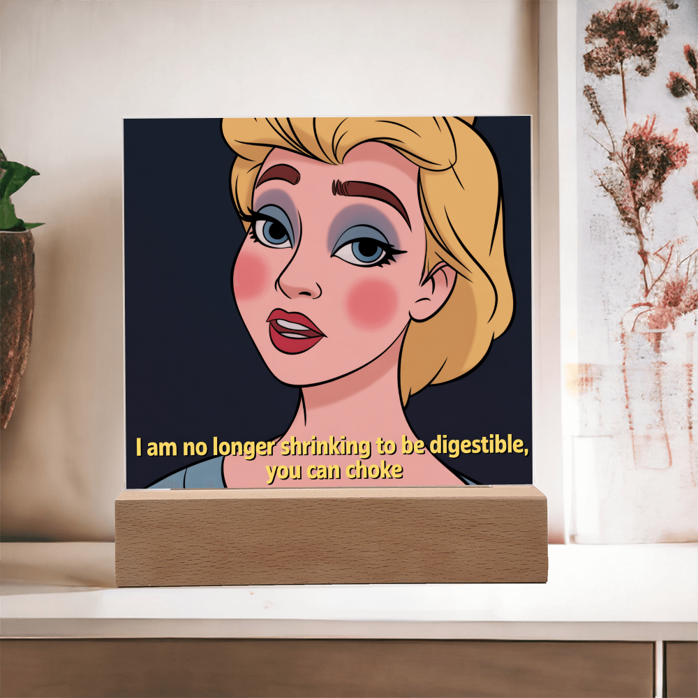 Softly lit photo of “No Longer Shrinking” acrylic sign creating empowering, reflective vibe in cozy corner