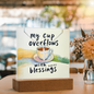 “My cup overflows with blessings” coffee cup artwork and cross necklace