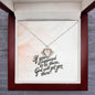 Close-up of crown pendant with dancing cubic zirconia center