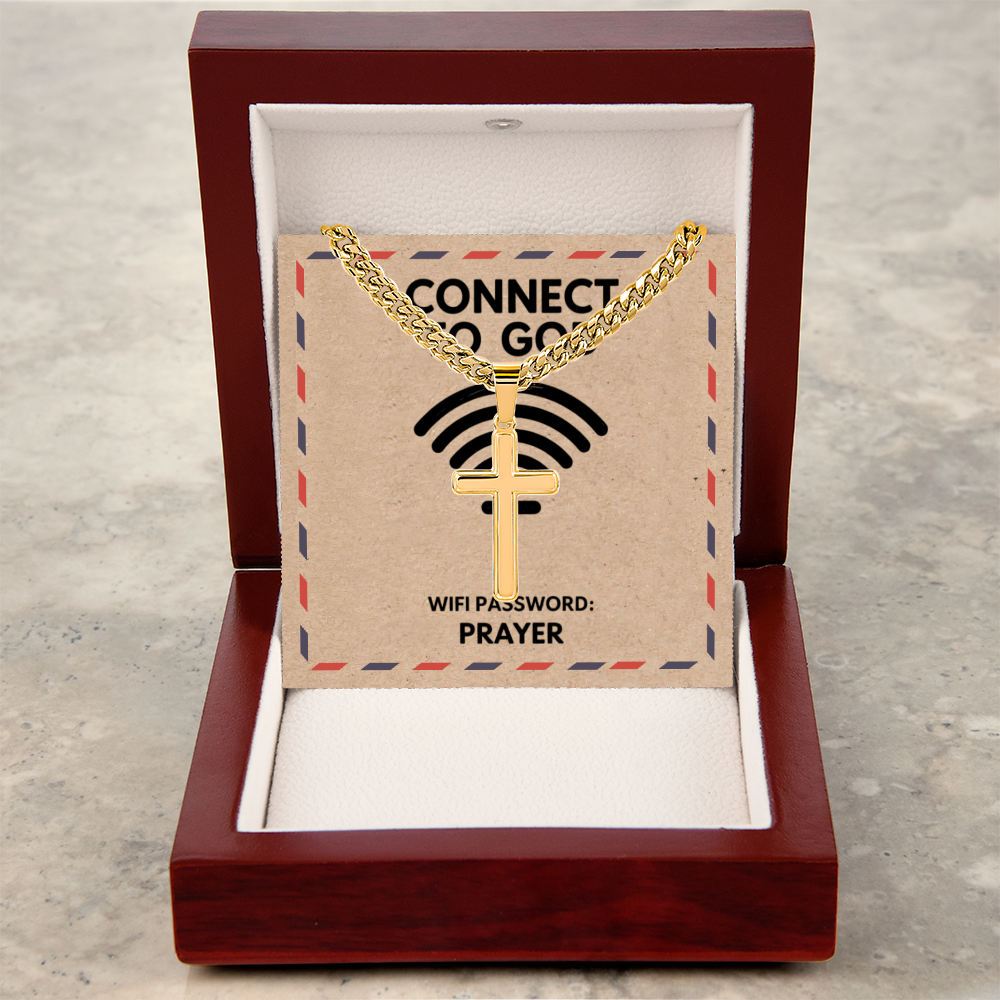 Stainless steel cross pendant displayed on Cuban link chain