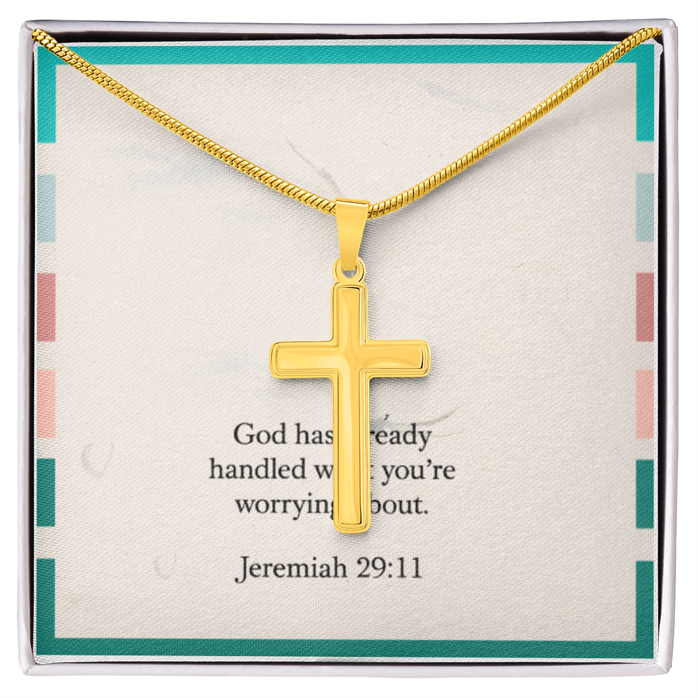 Cross pendant necklace styled beside Bible and journal