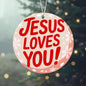 Faith-based Christmas ornament hanging on tree
