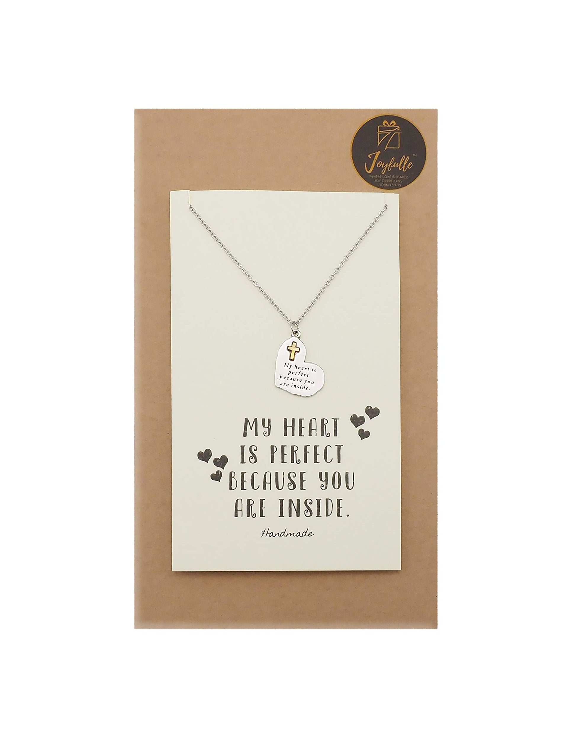 Necklace with a pendant on a card with text, displayed on a brown box.