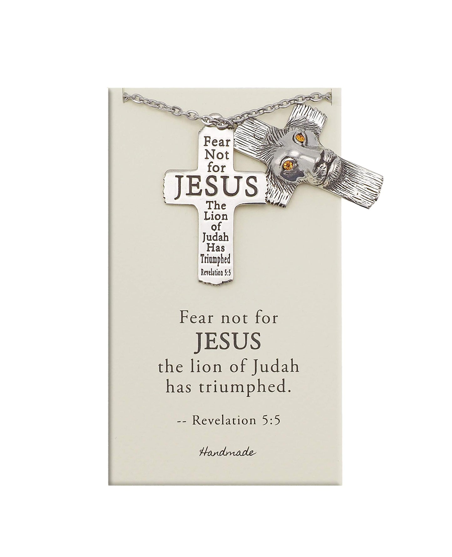 Silver cross necklace with lion charm on a card with religious text