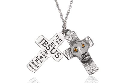 Silver cross necklace with lion head and 'Jesus' text on a white background