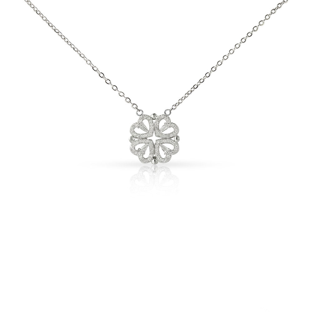 Silver necklace with a clover-shaped pendant on a white background