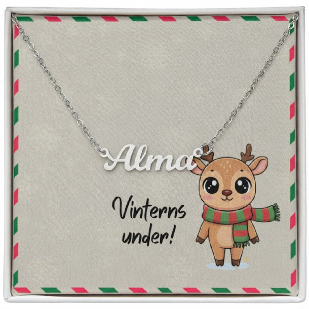 Necklace with a cartoon reindeer pendant and 'Alma' name on a decorative card.