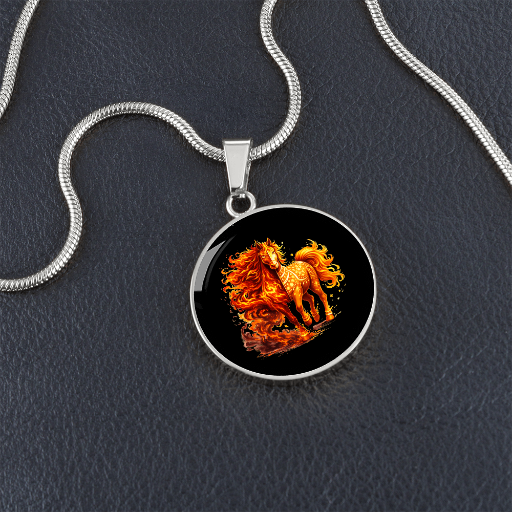 Close-up of fire horse pendant on black background