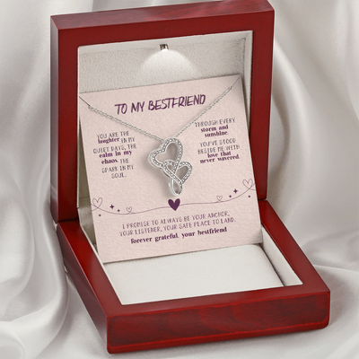 Two interlocking heart pendant on white background