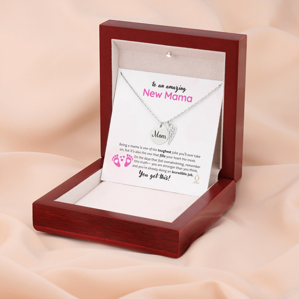 Interlocking Hearts necklace shown inside luxury gift box with LED spotlight