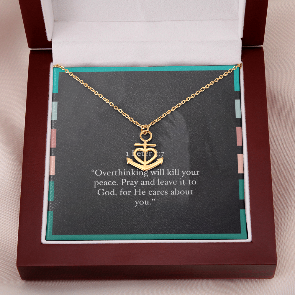 Anchor pendant shown beside open Bible and prayer journal