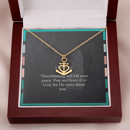 Anchor pendant shown beside open Bible and prayer journal