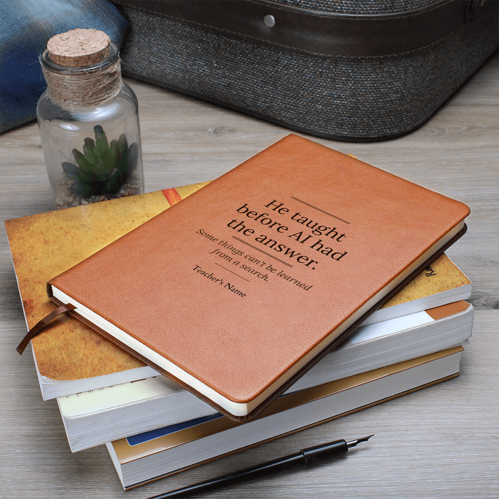 male teacher using journal in classroom
