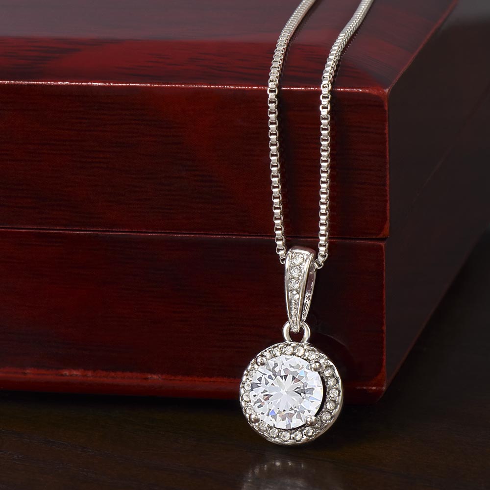 daughter wearing meaningful necklace from mom