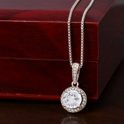daughter wearing meaningful necklace from mom