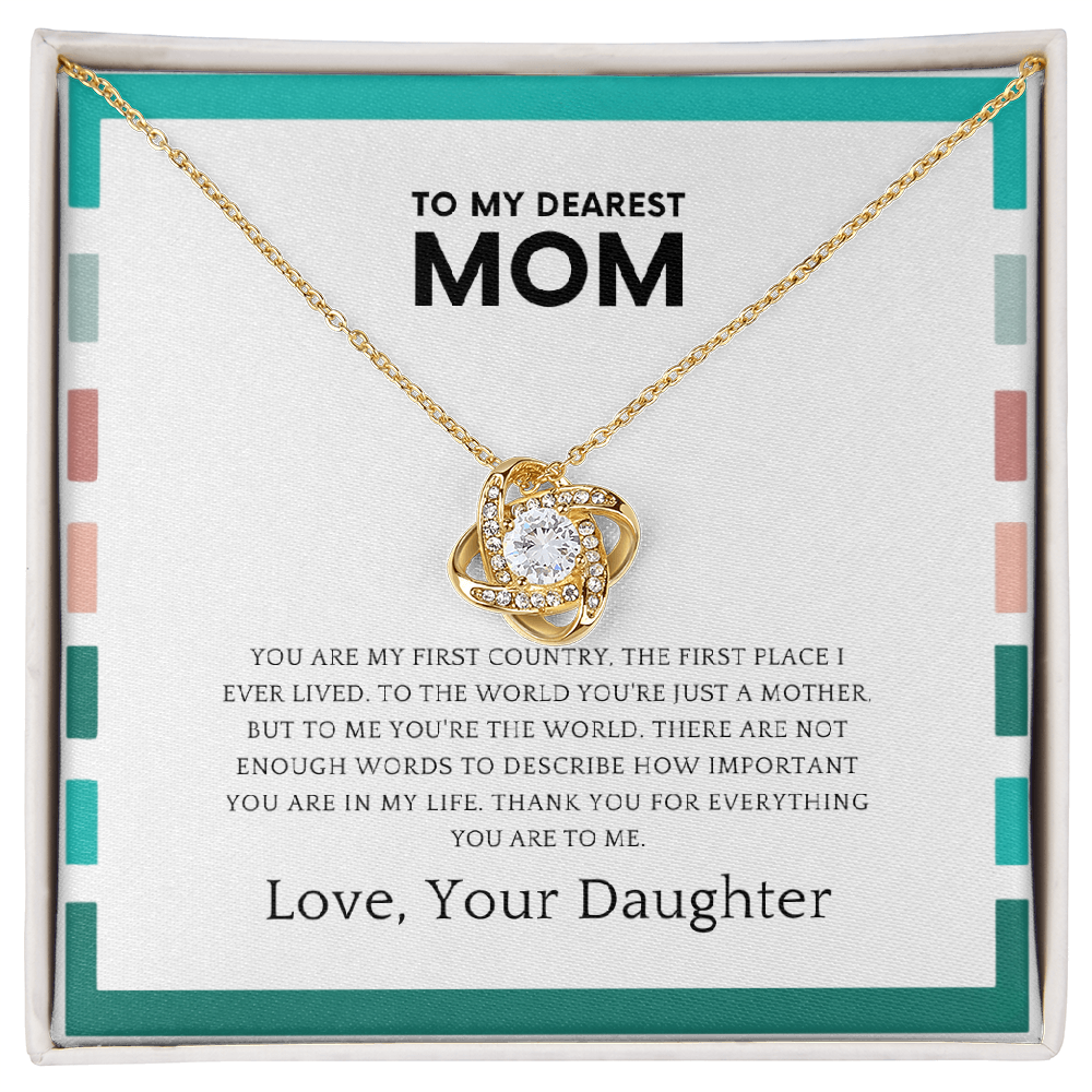 Mother wearing love knot necklace symbolizing daughter’s love