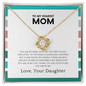 Mother wearing love knot necklace symbolizing daughter’s love