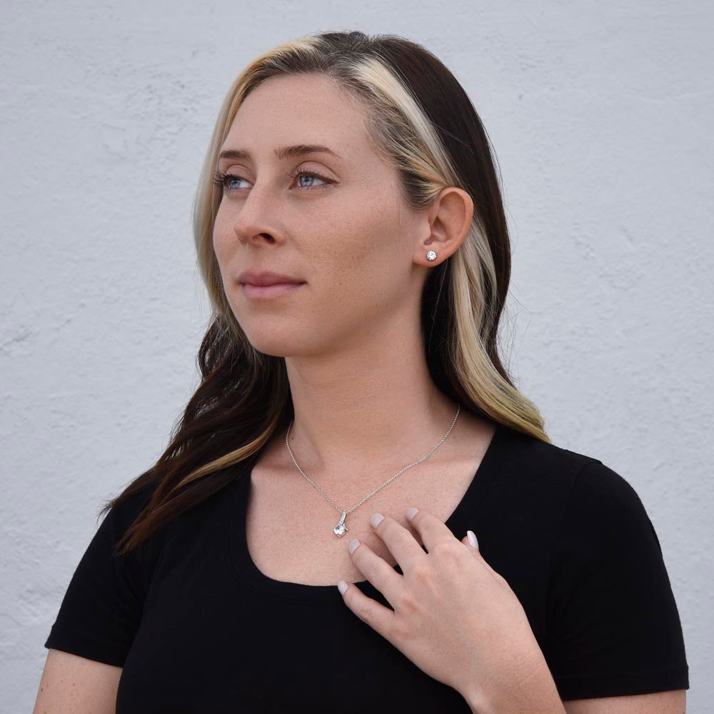 Gift box with festive holly design and holiday quote