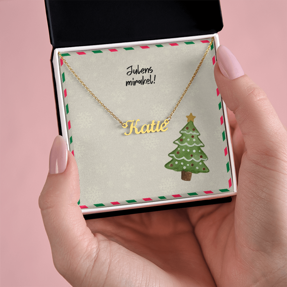 Elegant cursive name necklace holiday flatlay