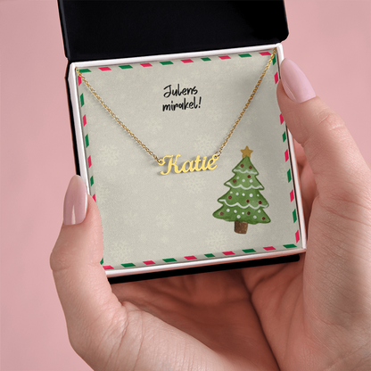 Elegant cursive name necklace holiday flatlay