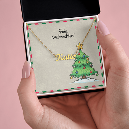 Gold name necklace displayed with German holiday theme