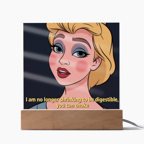 Acrylic plaque with the quote “I am no longer shrinking to be digestible. You can choke.” displayed on a white desk.