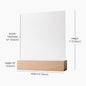 Inspirational quote plaque on nightstand creating warm, cozy lighting.