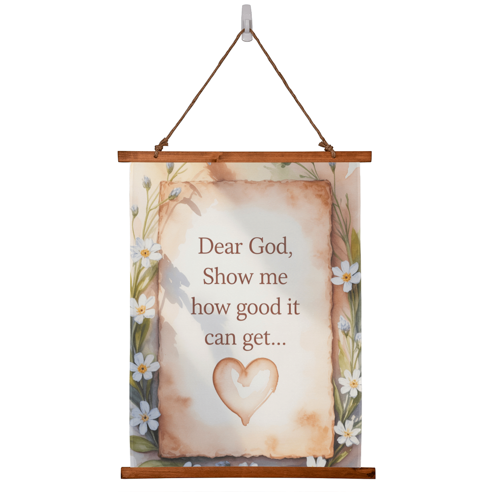 Dear God Show Me How Good It Can Get wall tapestry with wooden frame and floral border hanging on white wall