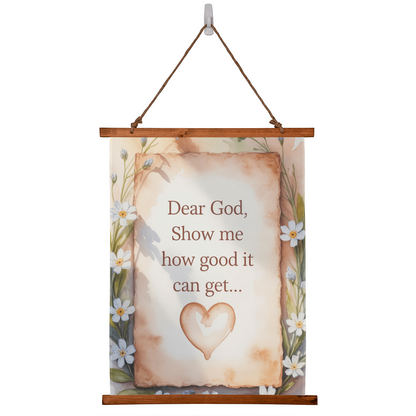 Dear God Show Me How Good It Can Get wall tapestry with wooden frame and floral border hanging on white wall