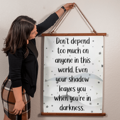 Close up of printed design on polyester fabric wood framed tapestry inspirational quote
