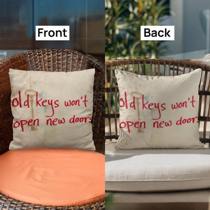 Close-up of printed quote “Old keys won’t open new doors” on fabric