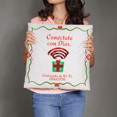 “Conéctate con Dios” faith pillow displayed on cozy holiday couch