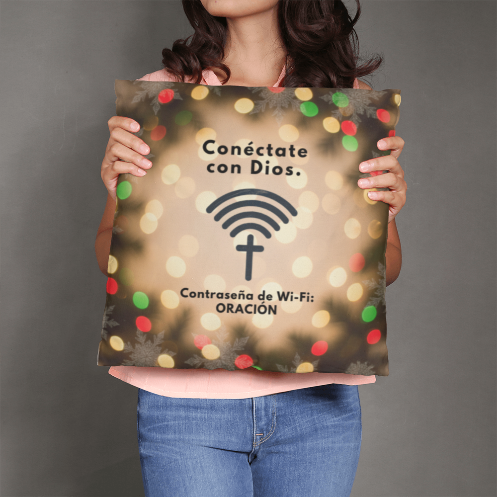 “Conéctate con Dios” pillow displayed on cozy holiday couch setup