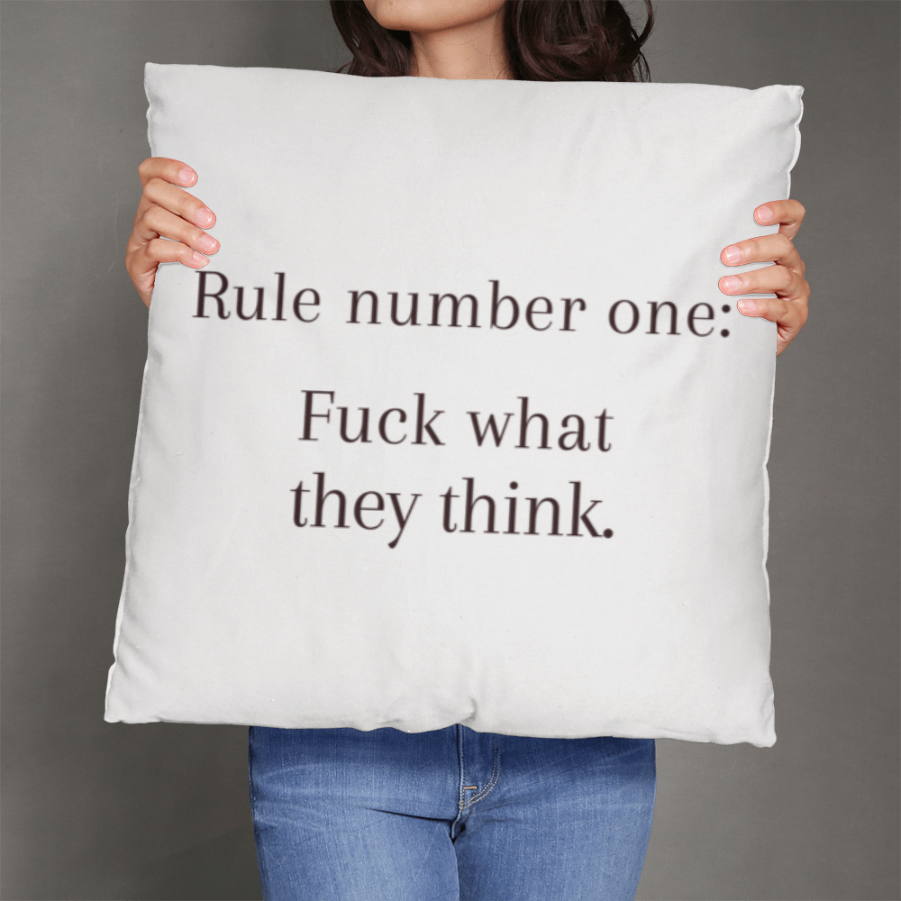 Oversized 26” motivational pillow on sofa as bold statement piece.
