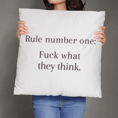 Oversized 26” motivational pillow on sofa as bold statement piece.