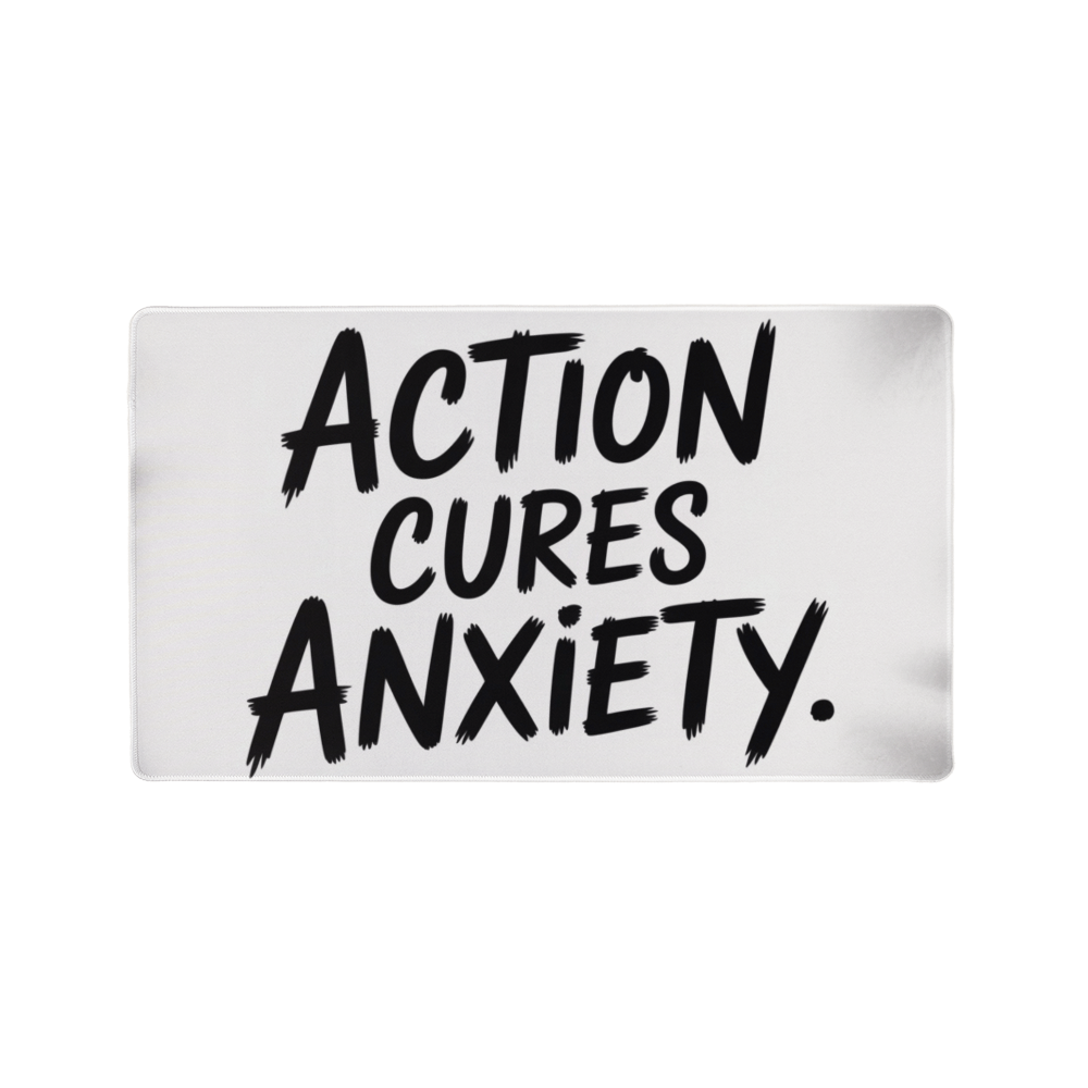 “Action Cures Anxiety” motivational gaming mat on modern desk setup