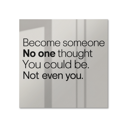 Motivational poster with quote “Become Someone No One Thought You Could Be” displayed on white wal