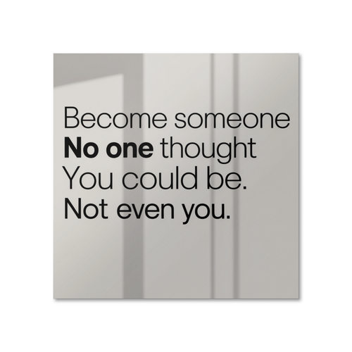 Motivational poster with quote “Become Someone No One Thought You Could Be” displayed on white wal