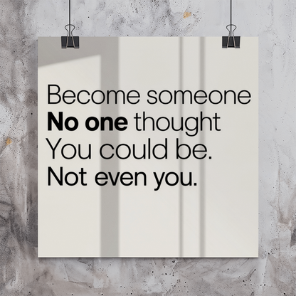 Inspirational poster hanging above desk in modern home office for motivation and self-belief.