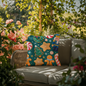 Festive nutcracker outdoor pillow on patio furniture