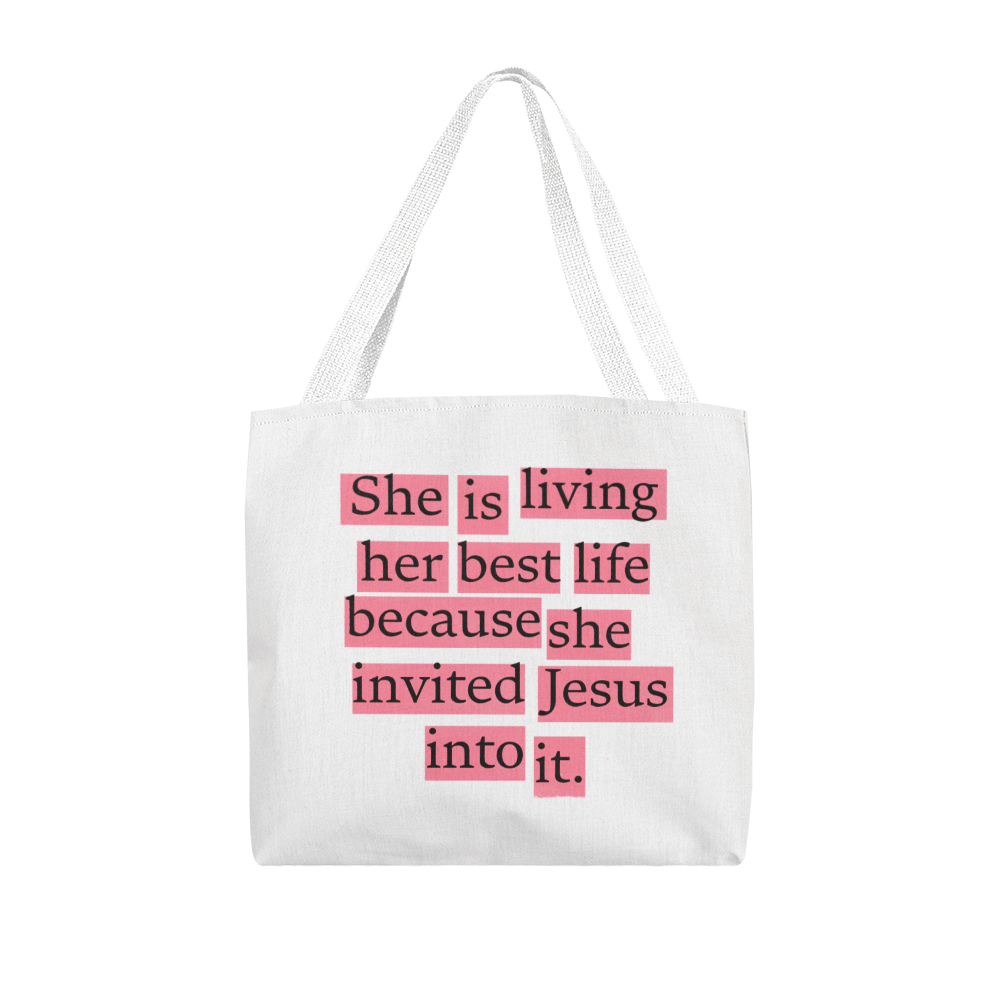 Christian tote bag displayed on church pew beside Bible and worship journal, symbolizing faith-filled living.