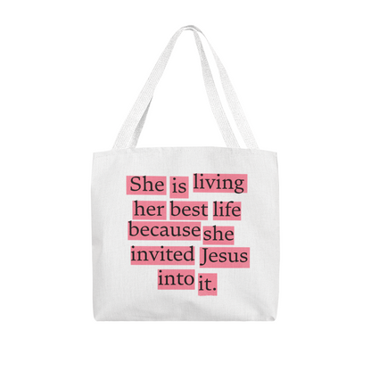 Christian tote bag displayed on church pew beside Bible and worship journal, symbolizing faith-filled living.