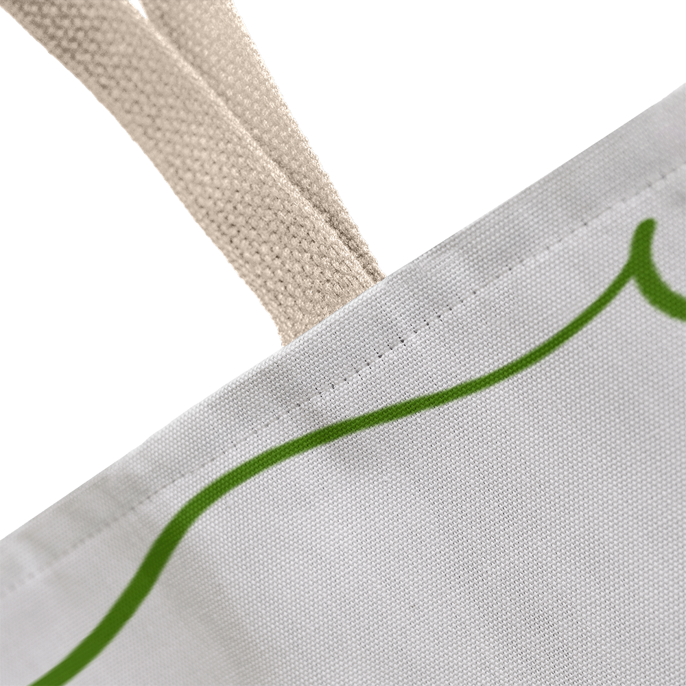 Tote displayed beside Christmas tree and wrapped gifts