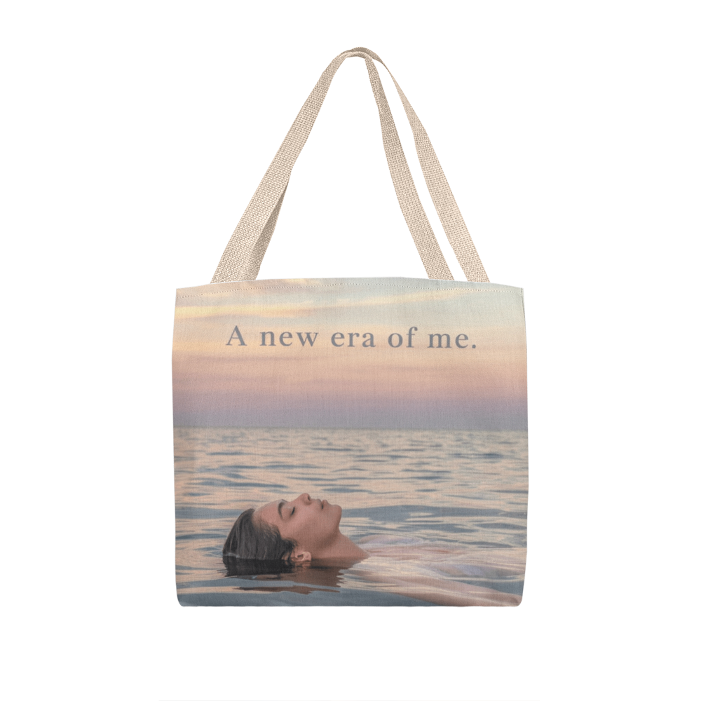 Close-up of “A New Era of Me” inspirational quote print on canvas tote