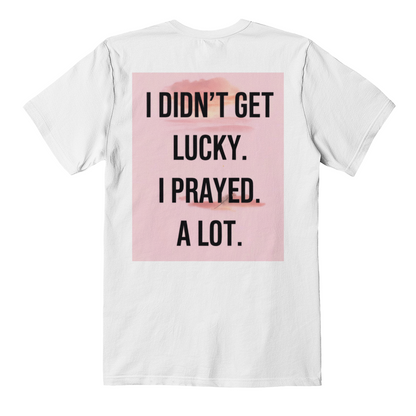 Soft cotton black tee folded with visible faith message